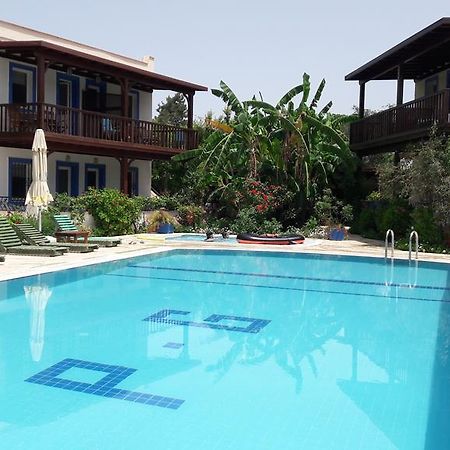 Апарт отель Paradise Garden Gumusluk Evleri Экстерьер фото